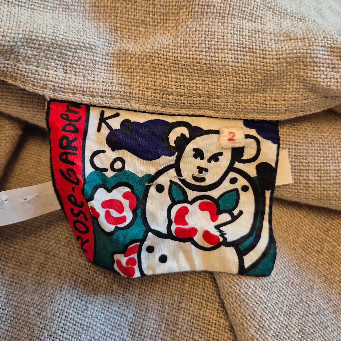 Ko and Co | Giacca ampia in lino beige con cappuccio