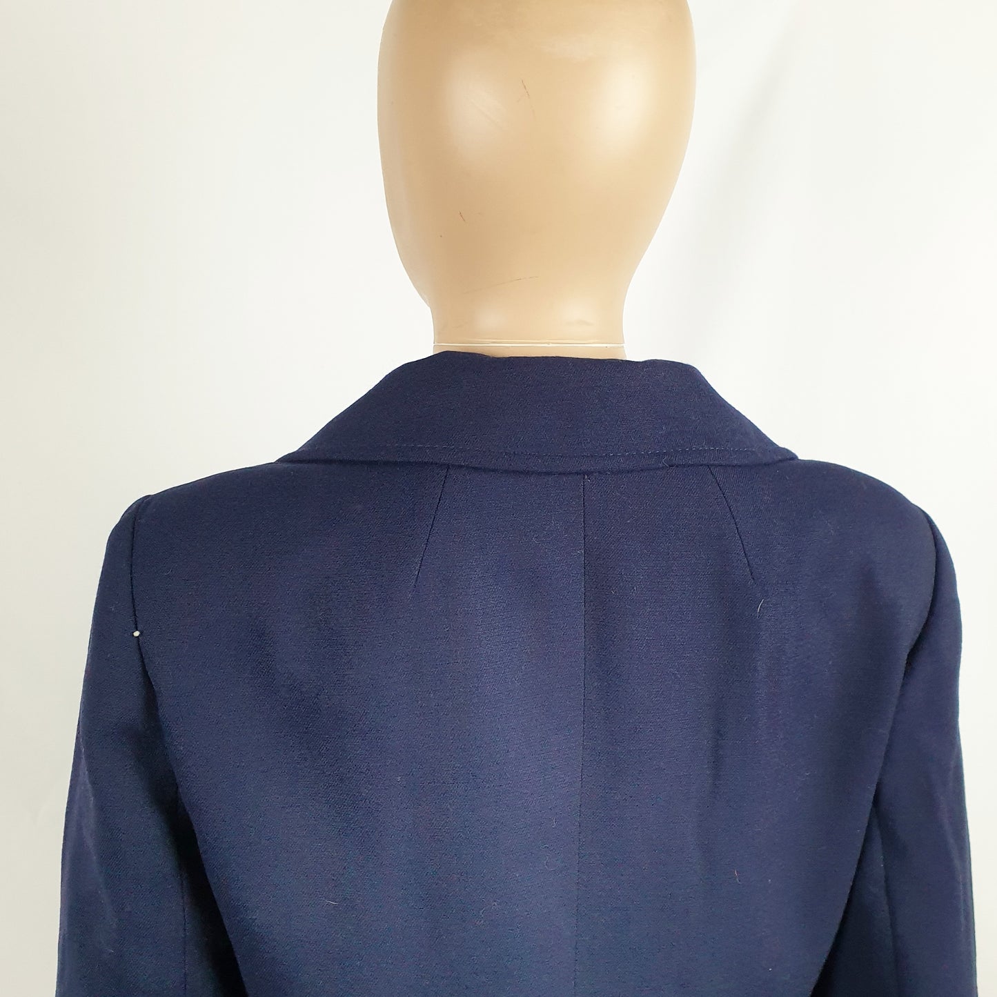 Giacca blu con bottoni e fibbia smaltati