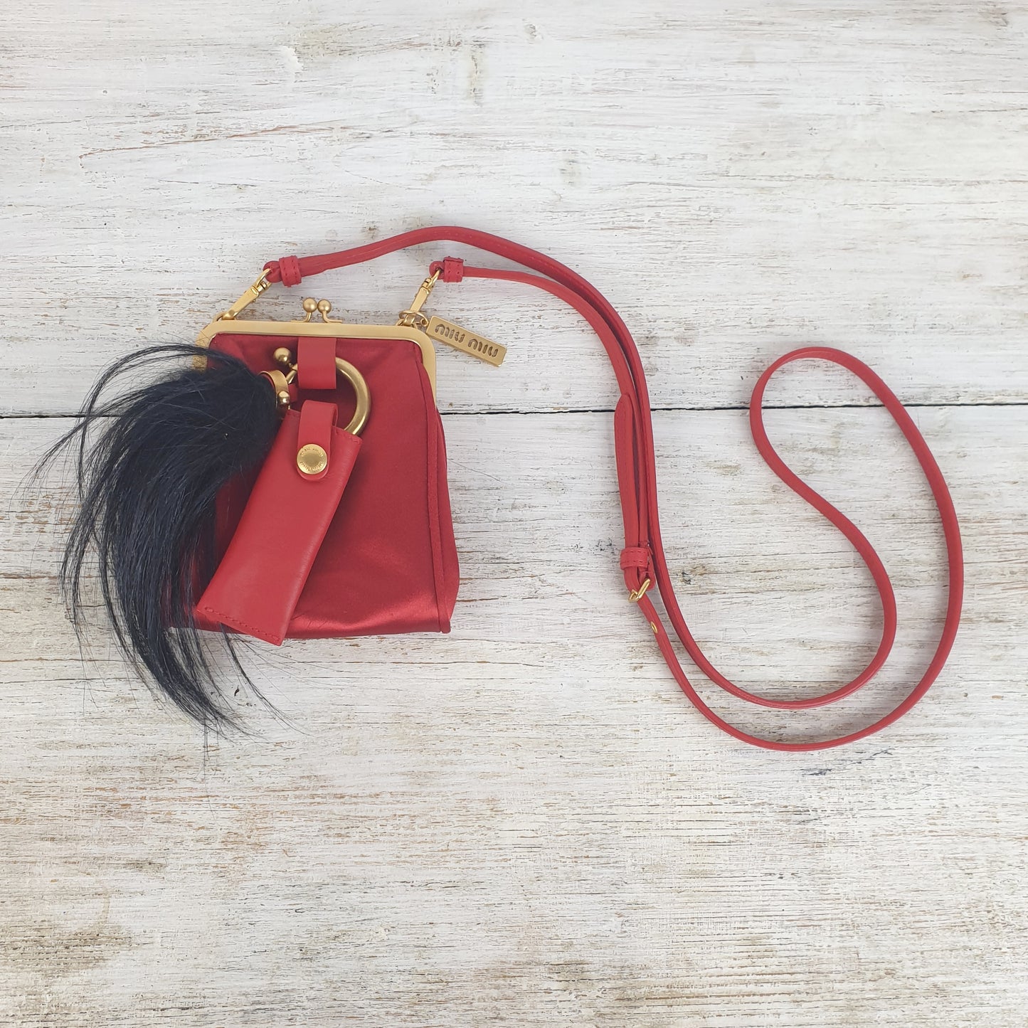 Micro bag Miu Miu rossa in raso e pelle