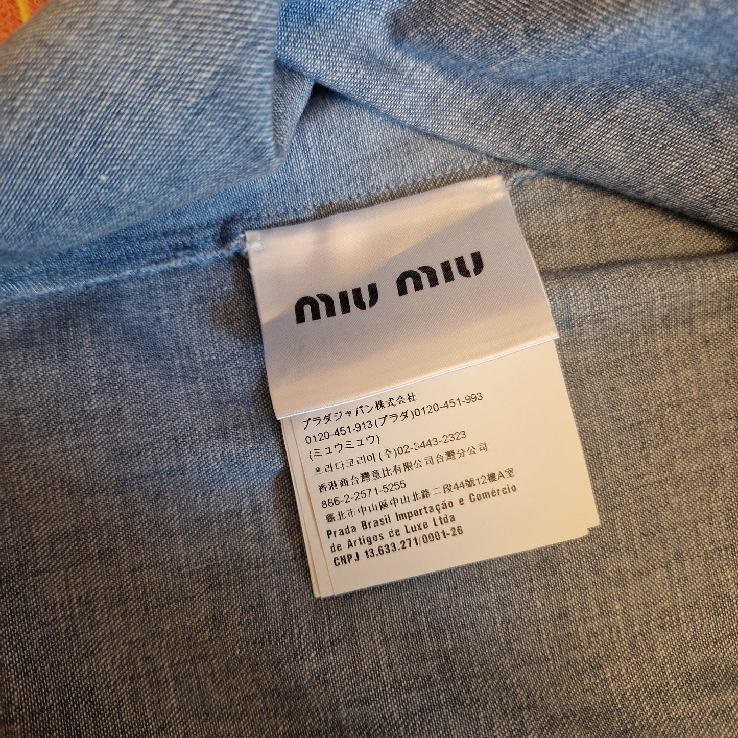 Miu Miu | Top in denim con fiocchetti