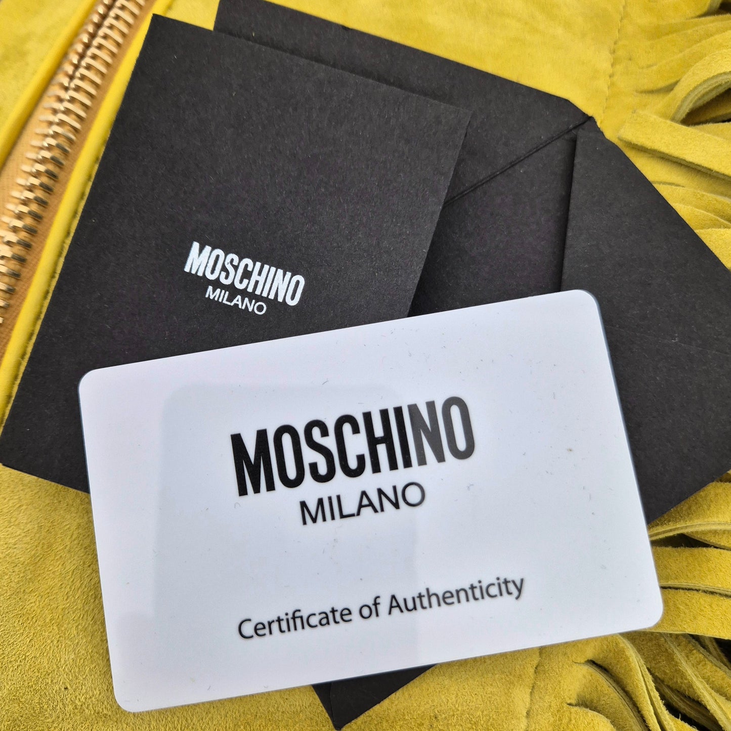 Moschino | Borsa suede giallo con frange