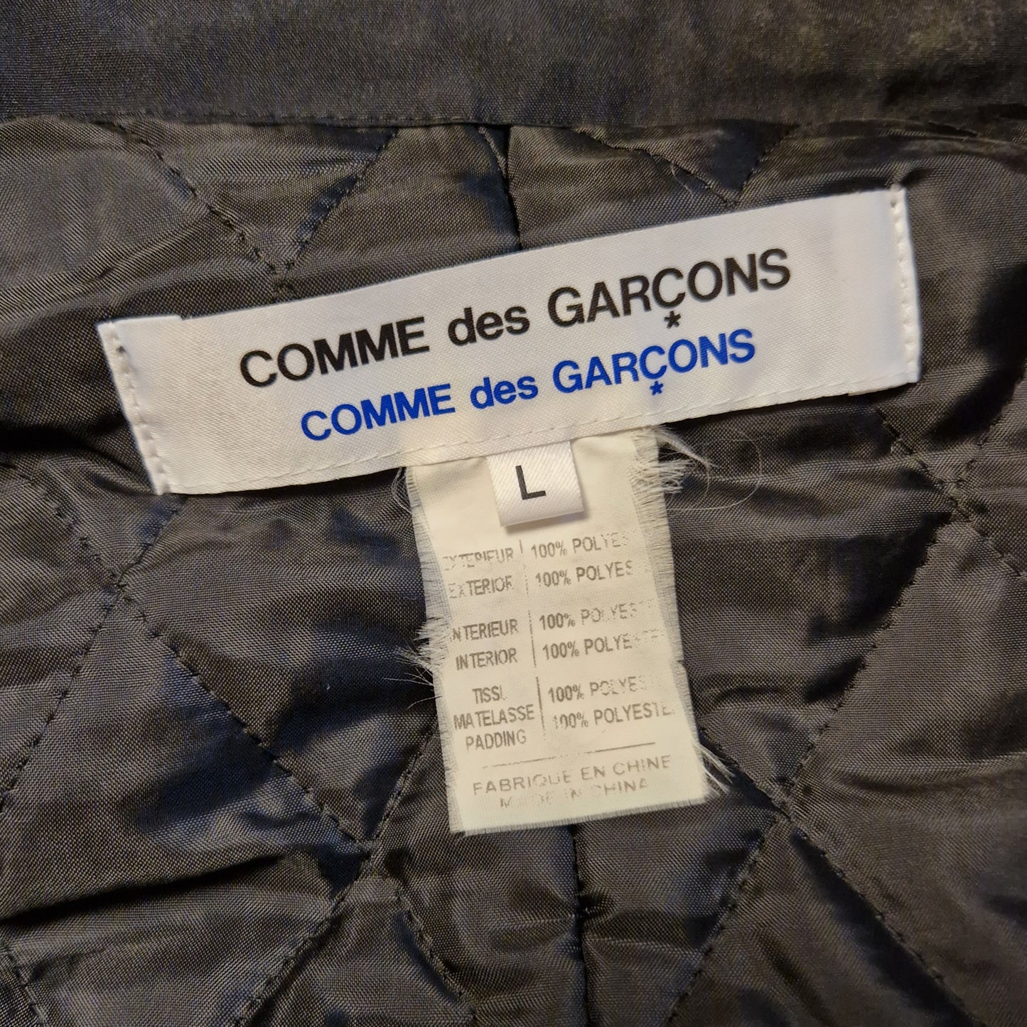 Piumino Comme des Garçons asimmetrico